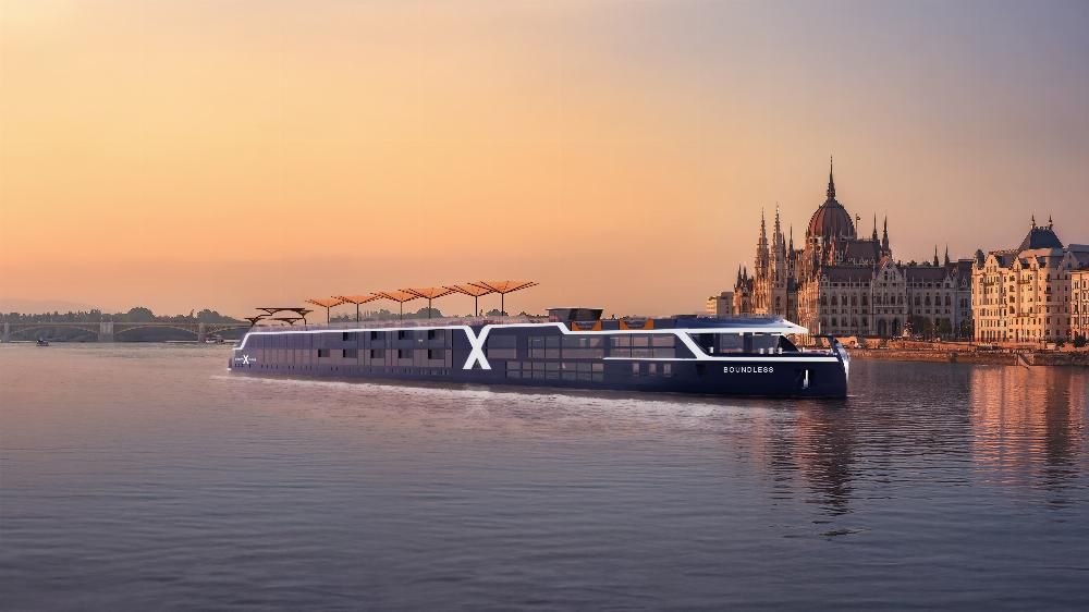 Celebrity River Cruises ship gliding along the water at golden hour