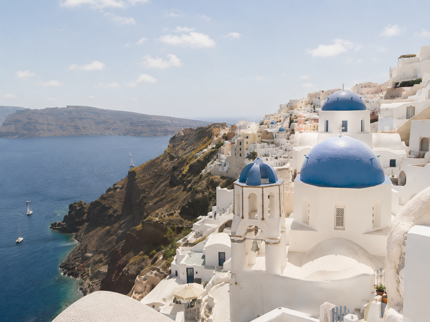 Blue-domed church overlooking the Aegean Sea in Santorini