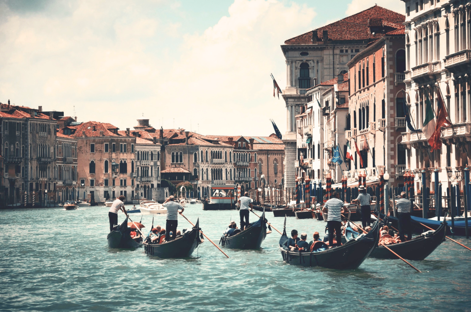 Quiet Venice canal lined with colorful buildings