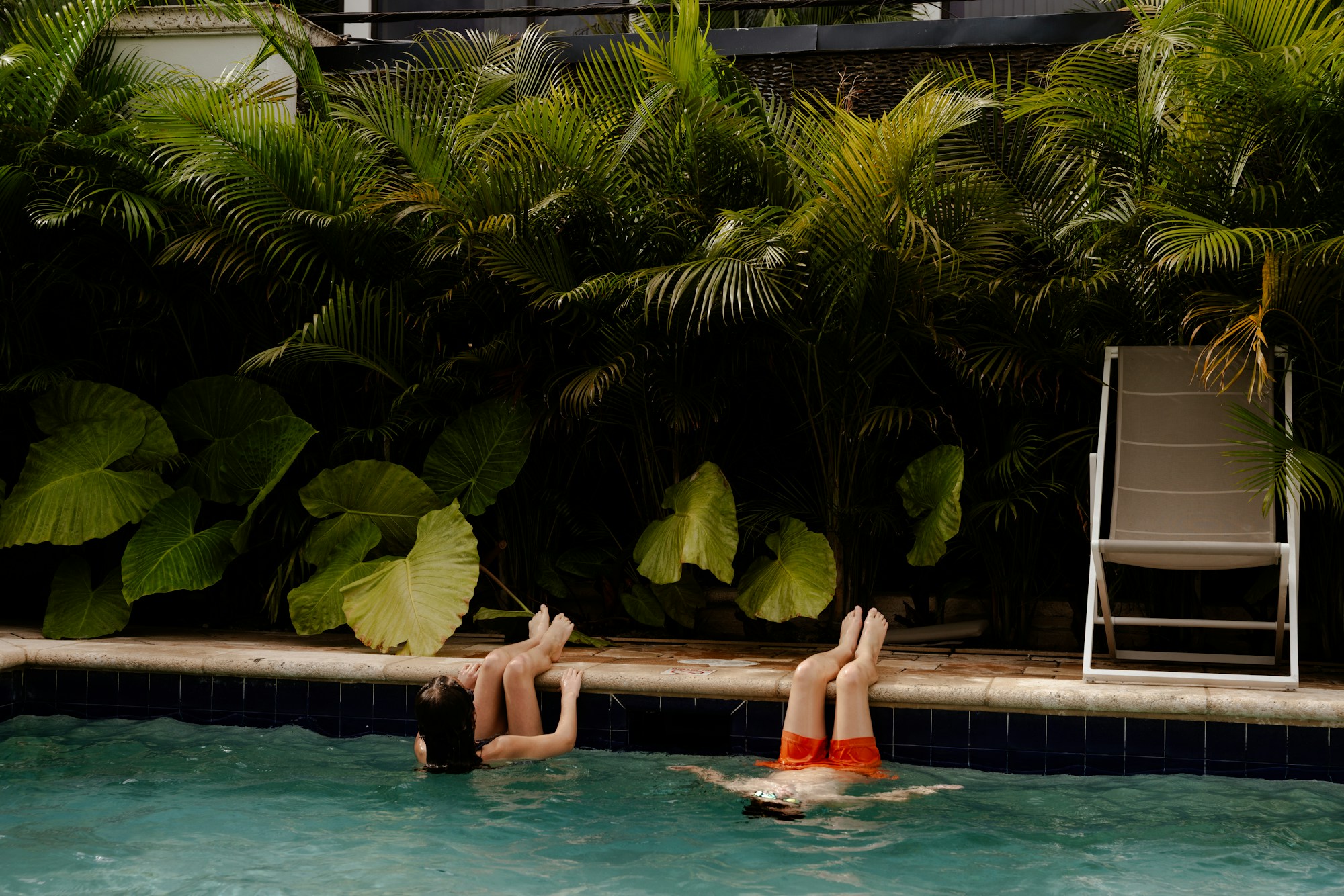 Children playing resort pool